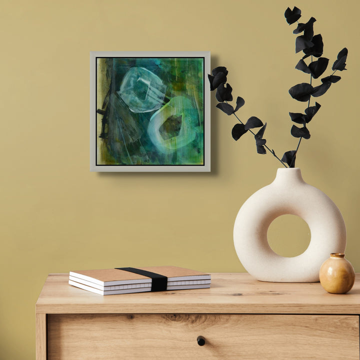 Framed abstract art on a wall for sale