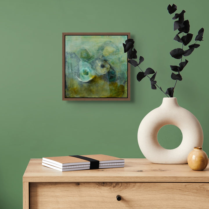Resin Art Abstract painting against a green wall.