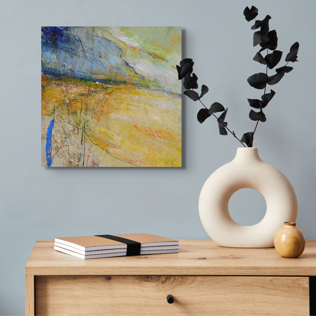 Blue and Yellow abstract painting hanging on a wall 