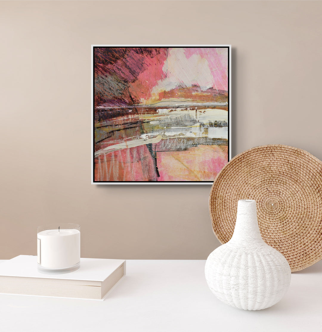 Small pink abstract painting on a wall.