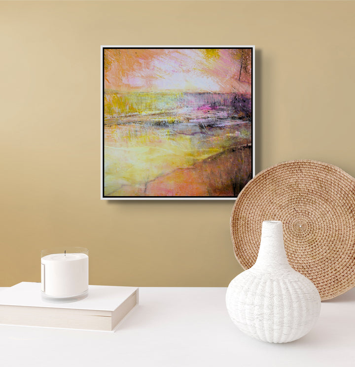 Abstract painting on a beige wall with pink, orange, yellow and white.