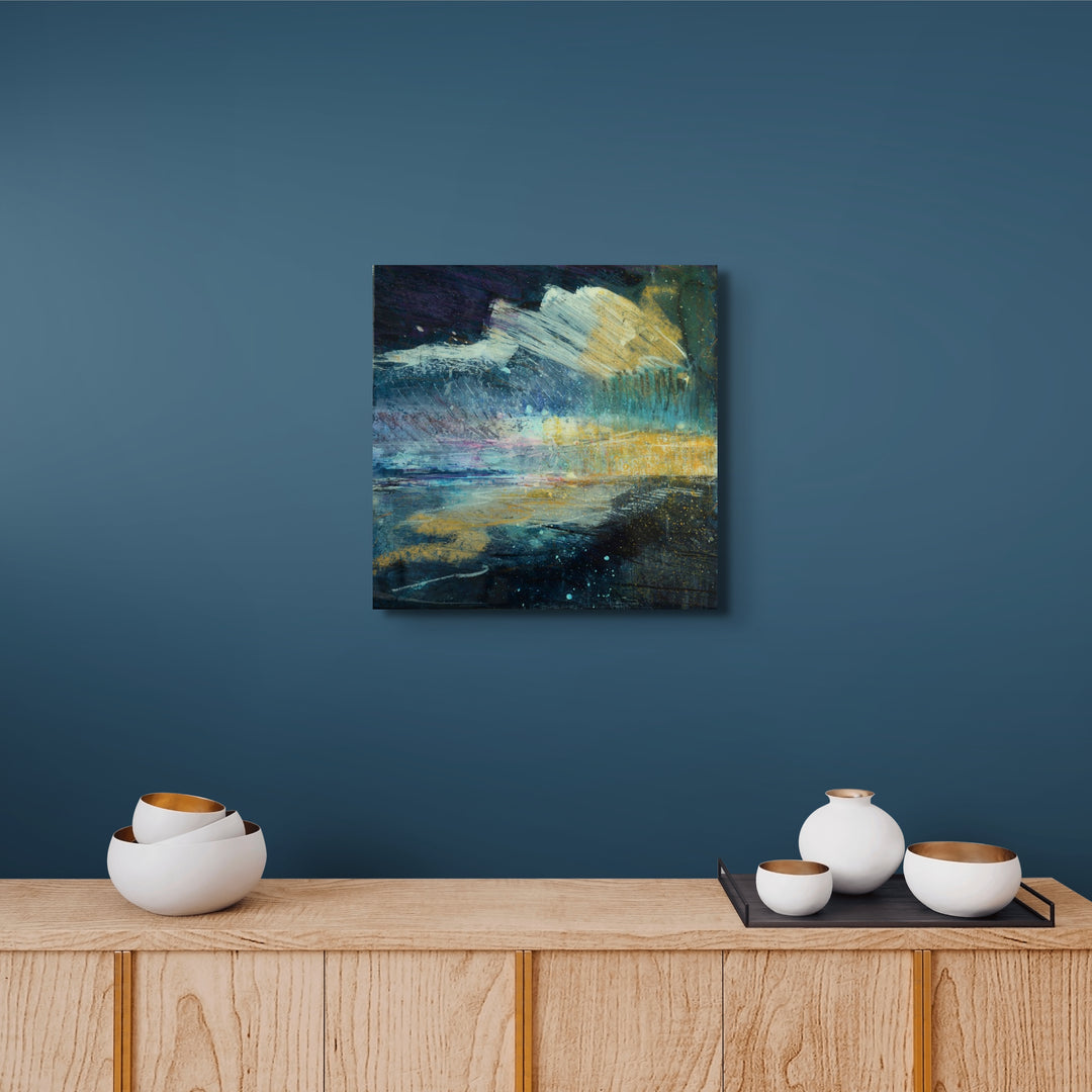 Navy blue abstract painting on a blue wall.