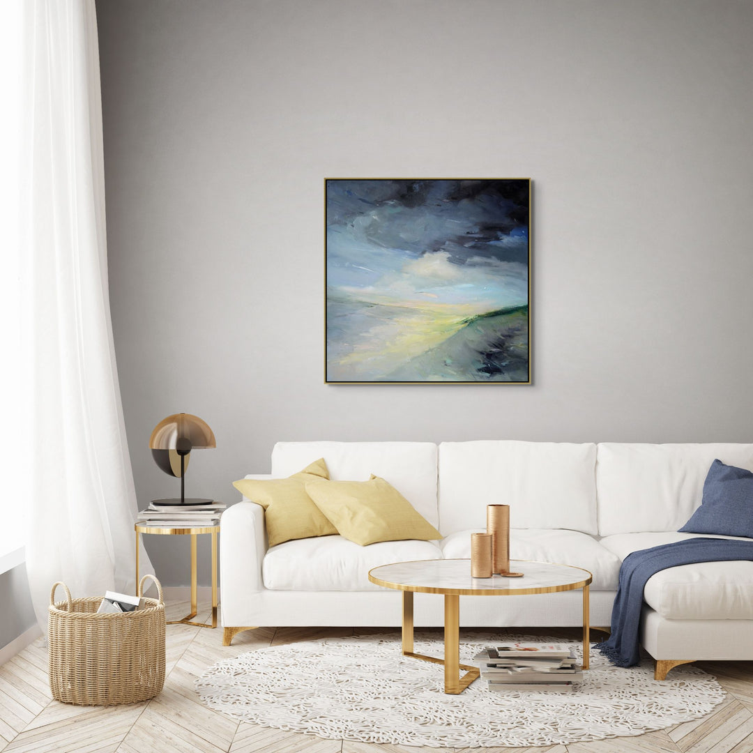 Modern living room with an abstract  sand dune painting on the wall.
