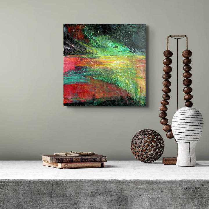 Abstract beach painting on a neutral wall.