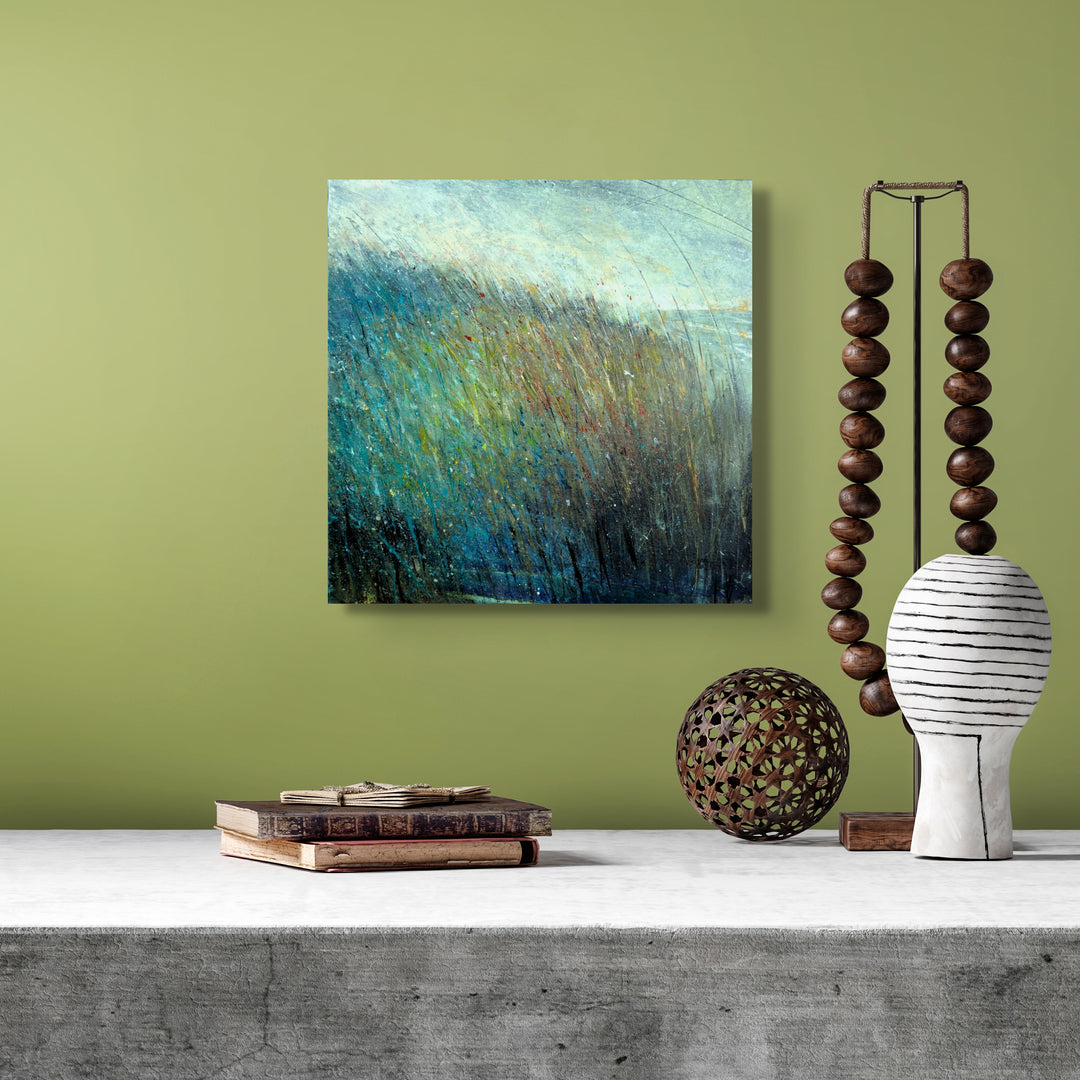 Square small abstract painting on a green wall.