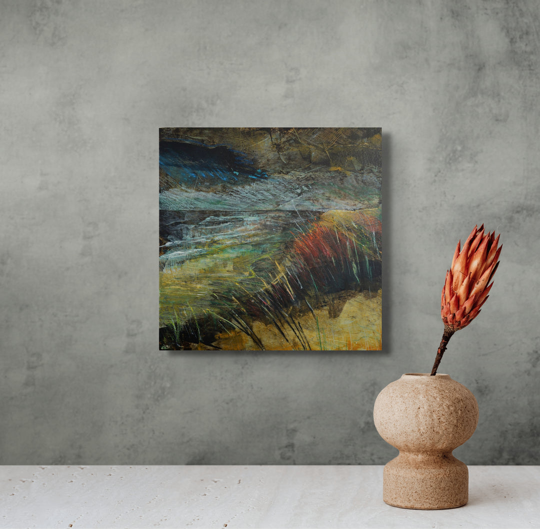 Abstract painting on a gray wall .