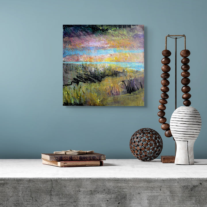 Small colorful abstract painting on a wall.